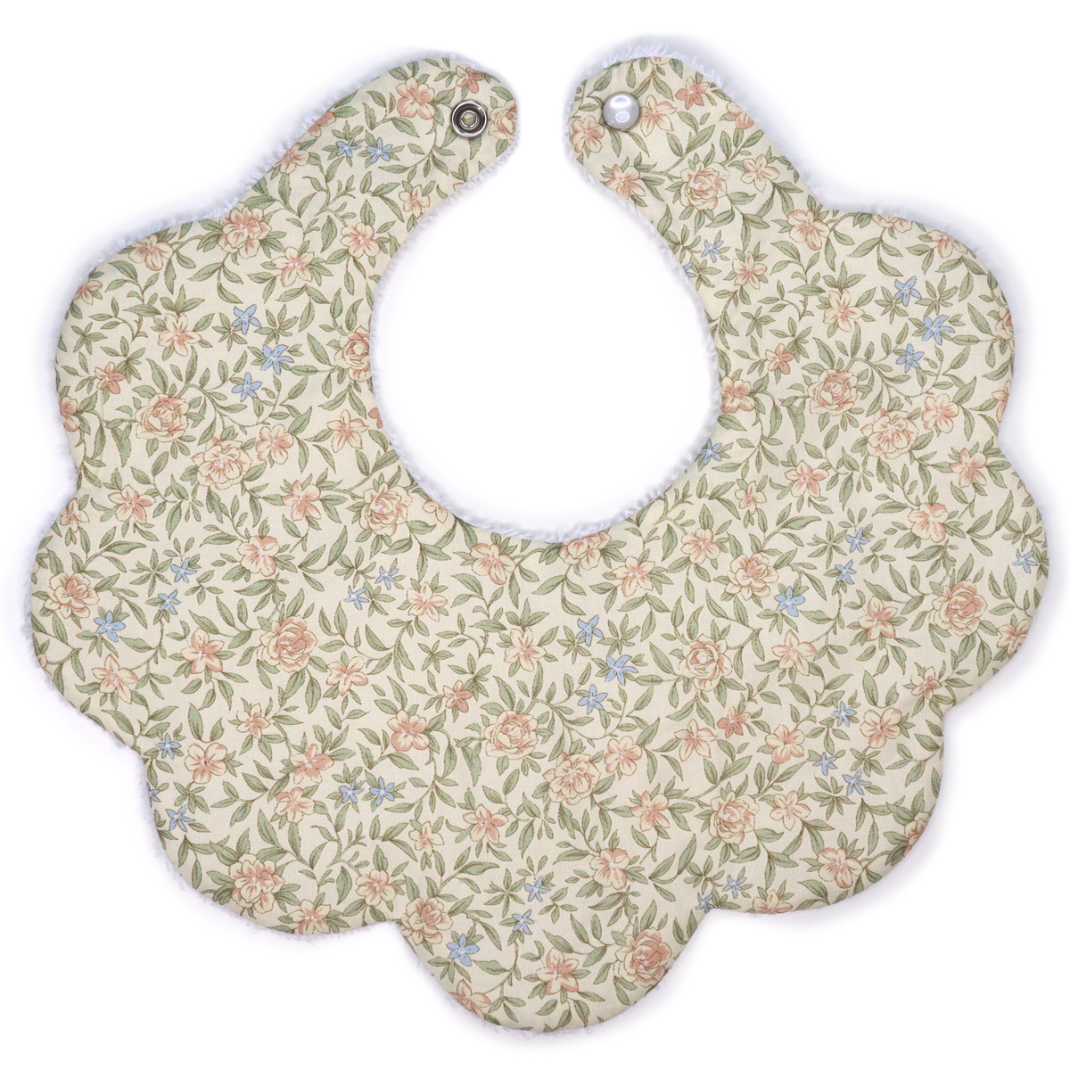 Floral patterned baby bib on a white background